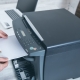 man working in xerox device in office